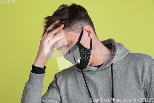 Image of Caucasian man\'s portrait isolated on yellow studio background - freaky model