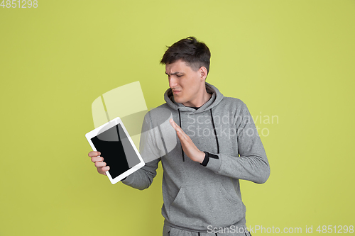 Image of Caucasian man\'s portrait isolated on yellow studio background - freaky model