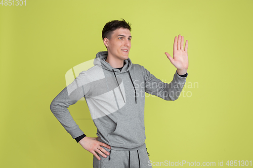 Image of Caucasian man\'s portrait isolated on yellow studio background - freaky model