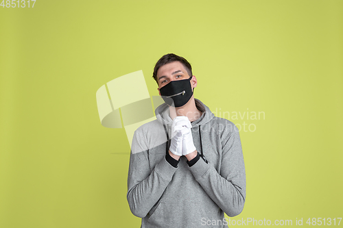 Image of Caucasian man\'s portrait isolated on yellow studio background - freaky model