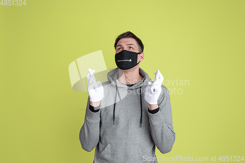 Image of Caucasian man\'s portrait isolated on yellow studio background - freaky model