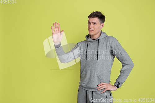 Image of Caucasian man\'s portrait isolated on yellow studio background - freaky model