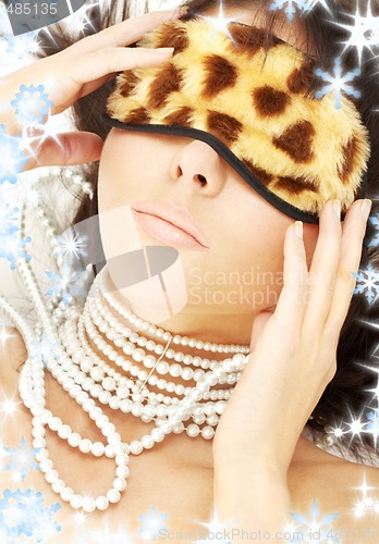 Image of pearls and leopard mask
