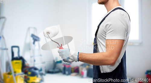 Image of close up of painter or builder with paint roller