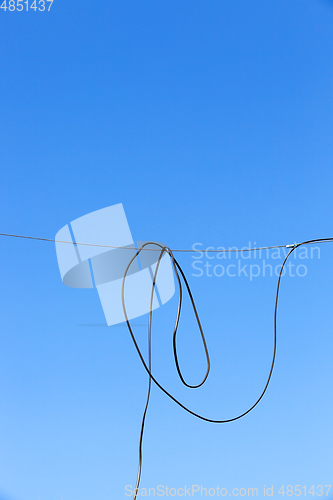 Image of wire with blue sky