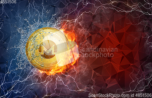 Image of Gold Monero coin hard fork in fire flame, lightning and water splashes.