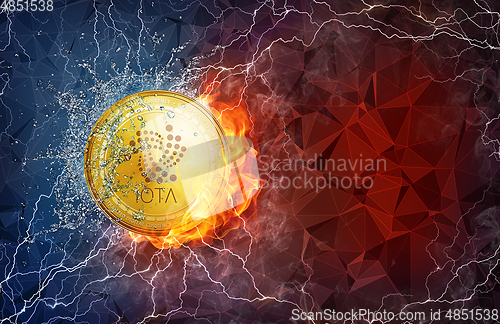 Image of Gold IOTA coin hard fork in fire flame, lightning and water splashes.