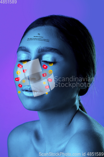 Image of Tears illustrated of social media activity signs on female face in neon light. Real life versus online lifestyle, addiction to modern technologies