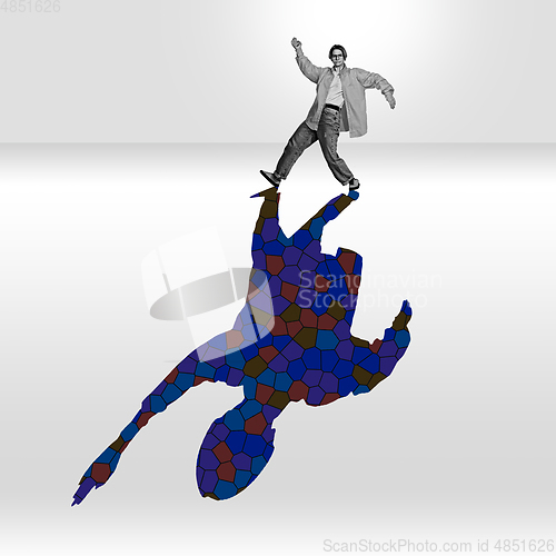 Image of Young caucasian dancer isolated on studio background with shadow, modern artwork. Abstract trendy design.