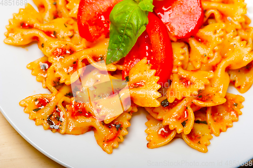 Image of Italian pasta farfalle butterfly bow-tie and tomato sauce