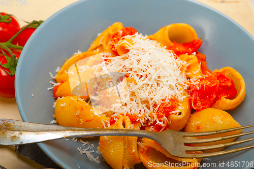 Image of Italian snail lumaconi pasta with tomatoes