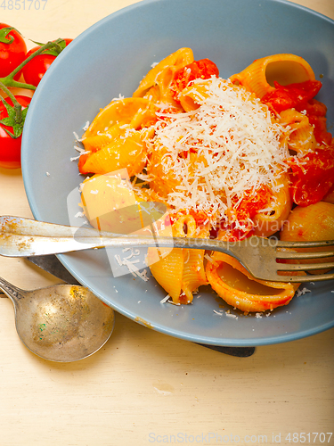 Image of Italian snail lumaconi pasta with tomatoes