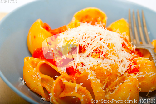 Image of Italian snail lumaconi pasta with tomatoes