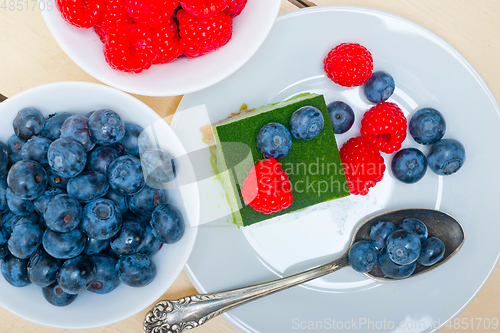 Image of green tea matcha mousse cake with berries