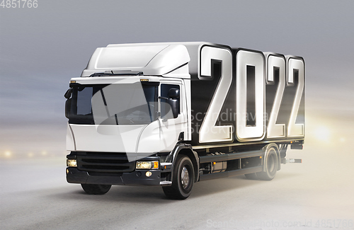 Image of truck delivers 2022 by new year in winter