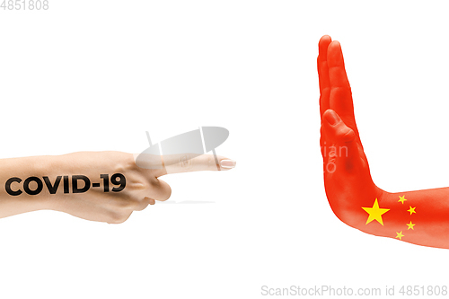 Image of Stop the epidemic. Human hands colored in flag of China and coronavirus - concept of spreading of virus