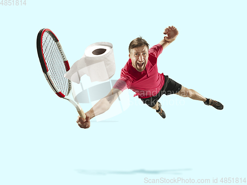 Image of Professional sportsman caught toiletpaper in motion and action - high demand for essential goods