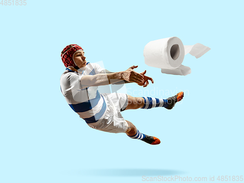 Image of Professional sportsman caught toiletpaper in motion and action - high demand for essential goods
