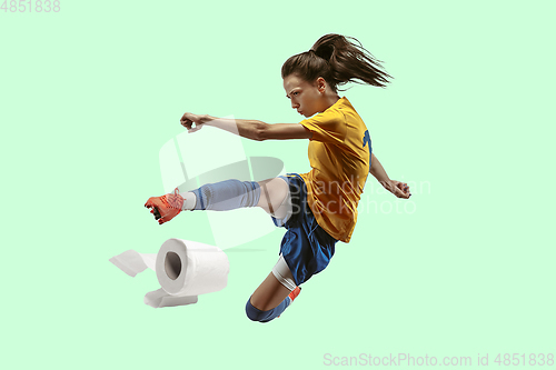 Image of Professional sportswoman caught toiletpaper in motion and action - high demand for essential goods