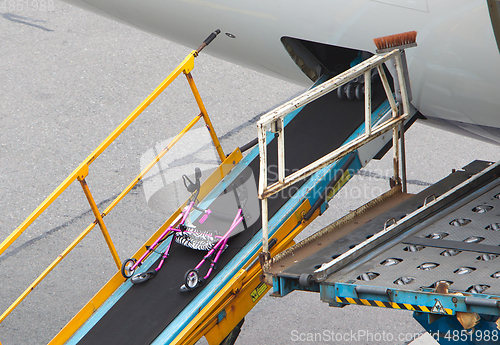 Image of AMSTERDAM, NETHERLANDS - JUNE 29, 2017: Loading luggage in airpl