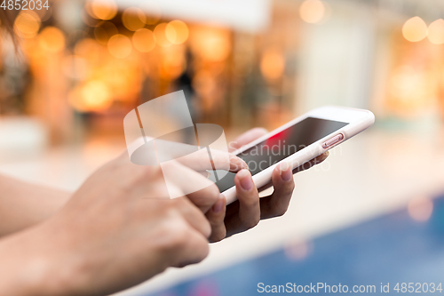 Image of Hand touching on cellphone