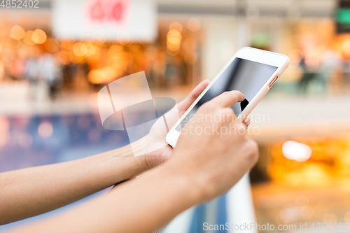 Image of Woman using mobile phone