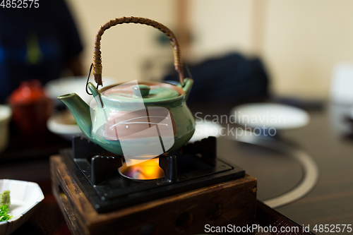 Image of Heating teapot