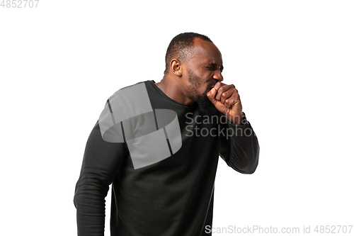 Image of How coronavirus changed our lives. Young man coughing on white background