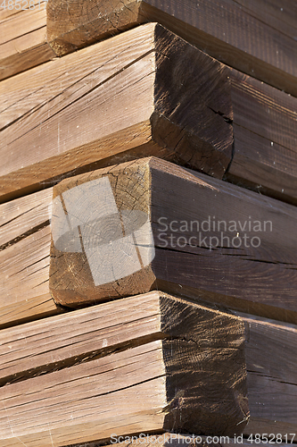 Image of house with wooden logs