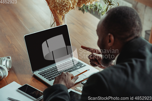 Image of Businessman or student working from home while being isolated or keep quarantine \'cause of coronavirus COVID-19