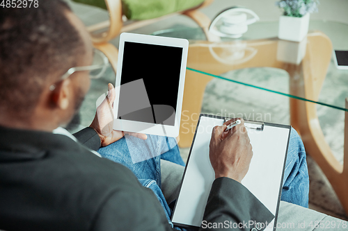 Image of Businessman or student working from home while being isolated or keep quarantine \'cause of coronavirus COVID-19