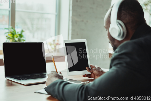 Image of Businessman or student working from home while being isolated or keep quarantine \'cause of coronavirus COVID-19