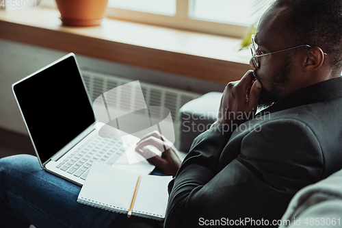 Image of Businessman or student working from home while being isolated or keep quarantine \'cause of coronavirus COVID-19