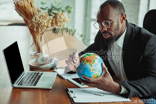 Image of Businessman or student working from home while being isolated or keep quarantine \'cause of coronavirus COVID-19