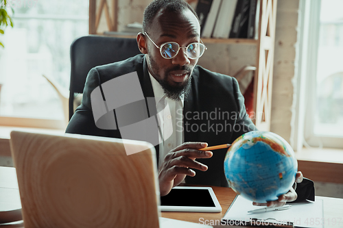 Image of Businessman or student working from home while being isolated or keep quarantine \'cause of coronavirus COVID-19