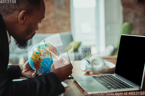 Image of Businessman or student working from home while being isolated or keep quarantine \'cause of coronavirus COVID-19