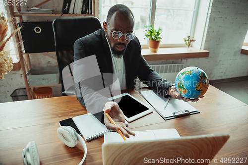 Image of Businessman or student working from home while being isolated or keep quarantine \'cause of coronavirus COVID-19