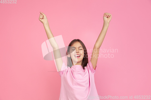 Image of Caucasian little girl portrait isolated on pink studio background, emotions concept