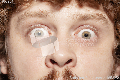 Image of Close up of face of beautiful caucasian young man, focus on eyes