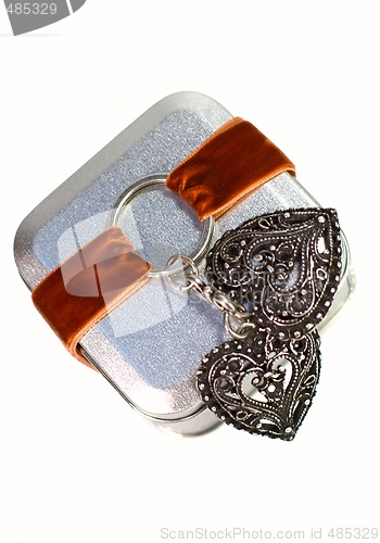 Image of metal gift box with decorative heart 