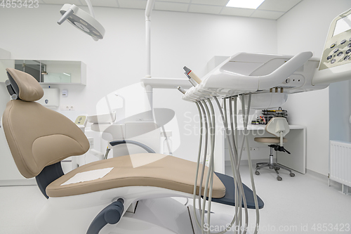 Image of patient chair in Interior of dentistry medical office