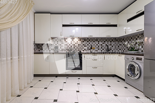 Image of Brown and white modern kitchen interior