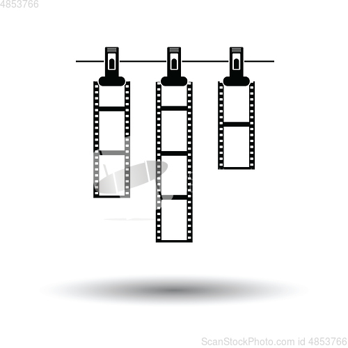 Image of Icon of photo film drying on rope with clothespin