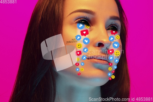 Image of Tears illustrated of social media activity signs on female face in neon light. Real life versus online lifestyle, addiction to modern technologies