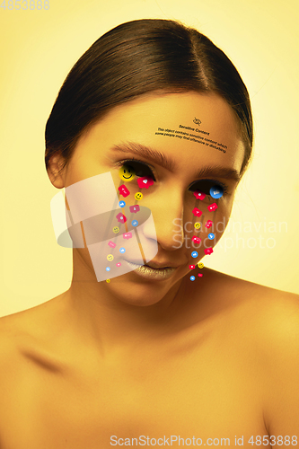 Image of Tears illustrated of social media activity signs on female face in neon light. Real life versus online lifestyle, addiction to modern technologies