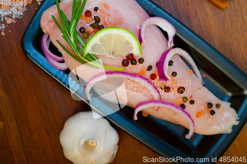 Image of fresh organic chicken breast with herbs and spices