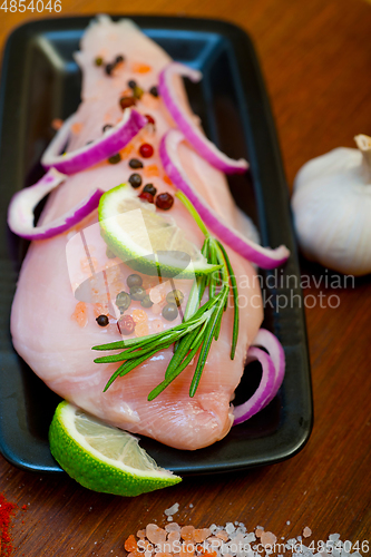 Image of fresh organic chicken breast with herbs and spices