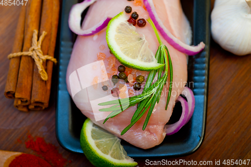 Image of fresh organic chicken breast with herbs and spices