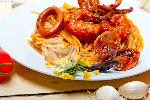 Image of Italian seafood spaghetti pasta on red tomato sauce