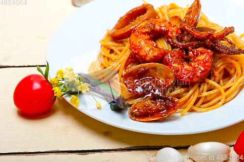 Image of Italian seafood spaghetti pasta on red tomato sauce